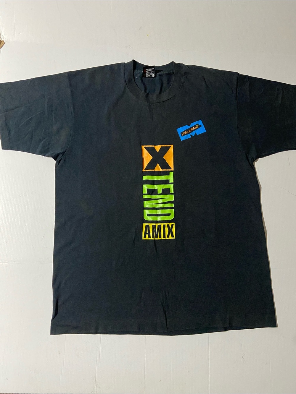 1990s black t-shirt features a bold "X-TENDAMIX" graphic and a MuchMusic logo